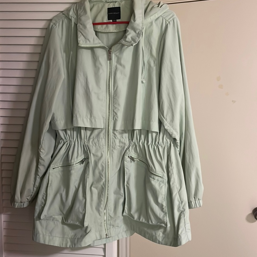 Lane Bryant rain jacket. Size 14/16. Zipper front, zipper pockets. Hood.
